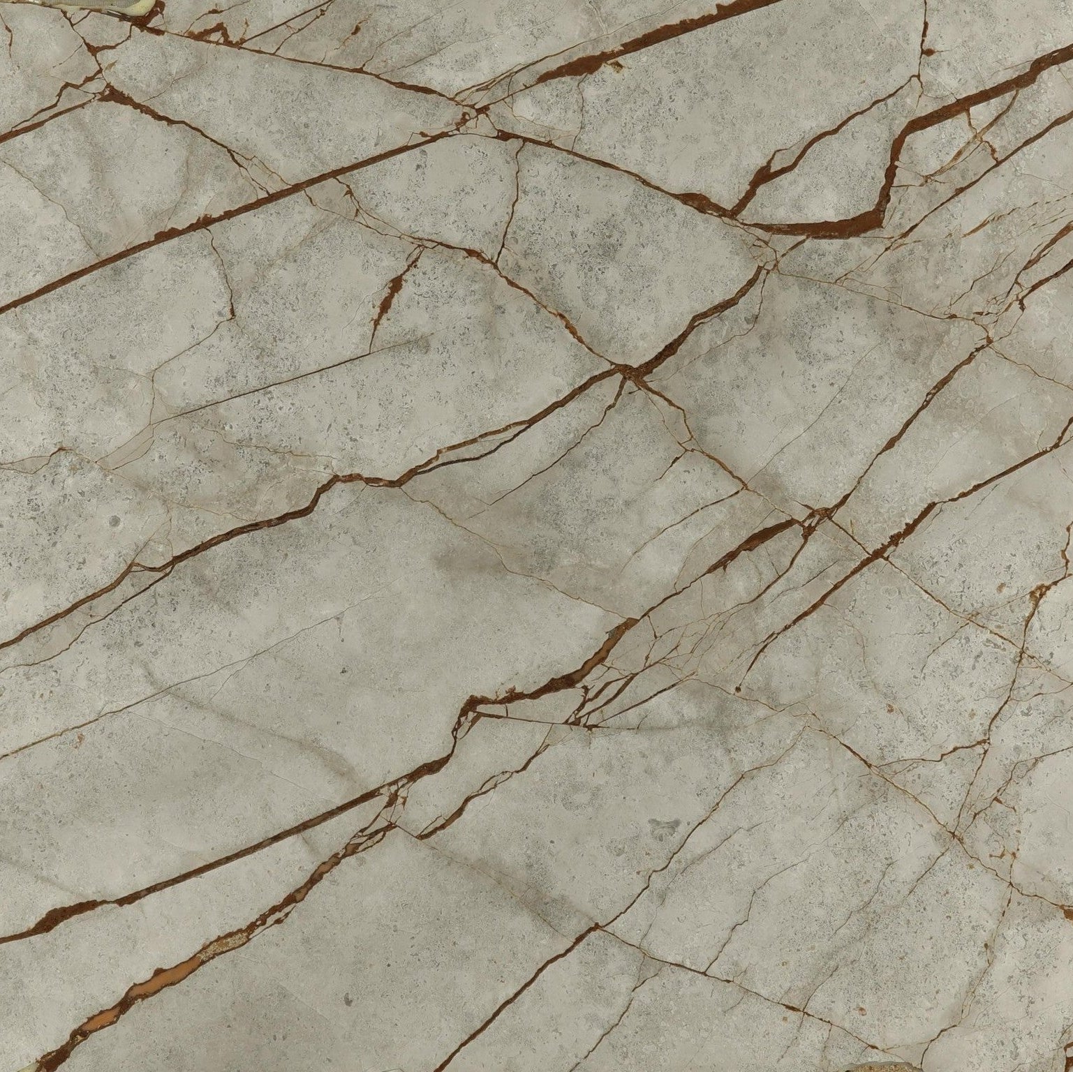 Close-up of a marble-like surface with beige and brown tones
